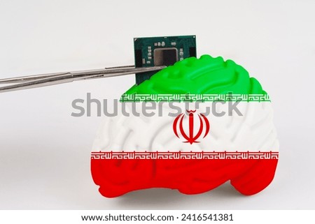 On a white background, a model of the brain with a picture of a flag - Iran, a microcircuit, a processor, is implanted into it. Close-up