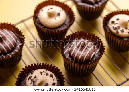 Close up image of white chocolate and milk mini cupcakes