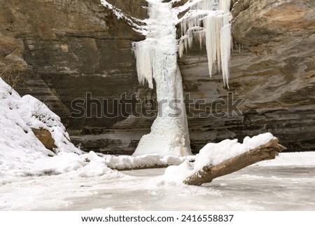 Frozen waterfall in Ottawa canyon on a brisk winter morning.  Starved Rock state park, Illinois, USA