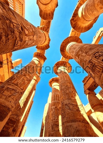 Hypostyle Hall with huge columns in Karnak temple in Luxor, Egypt. Royalty-Free Stock Photo #2416579279