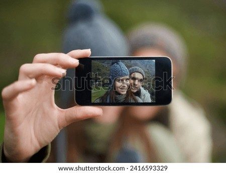 Couple, hiking and smartphone for selfie in nature, camera and capture moment in outdoors. People, happy and picture for memory and exploring wilderness, trekking and photograph for social media