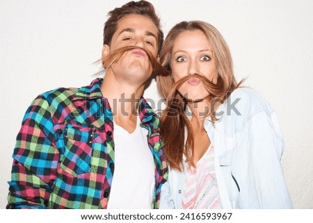 Silly portrait of couple with hair moustache, funny face and gen z fashion with university culture in youth. Happiness, woman and hipster man in crazy picture at fun college event on wall background.