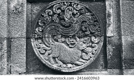 A temple stone relief in a Southeast Asian country depicts a fox with a very beautiful flower-shaped tail, showcasing the cultural richness and artistic intricacies of the region.
