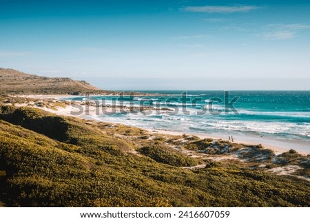 Misty Cliffs Beach Scenery with waves Royalty-Free Stock Photo #2416607059