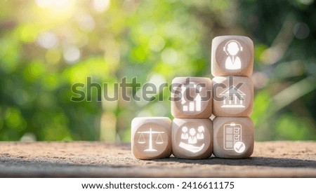 Social work concept. Wooden block on desk with social work icon on virtual screen. Society, Psychology, Social Justice, Sociology, Improvement, Economics, Community Development, Government.