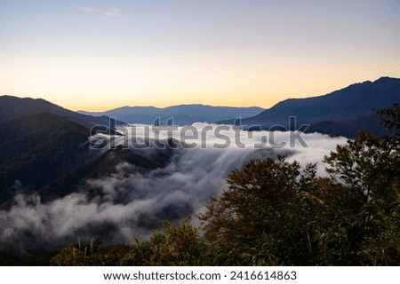 Shioritoge Pass before sunrise
Clouds flowing down and over the mountains
View of Niigata Prefecture, Japan Royalty-Free Stock Photo #2416614863