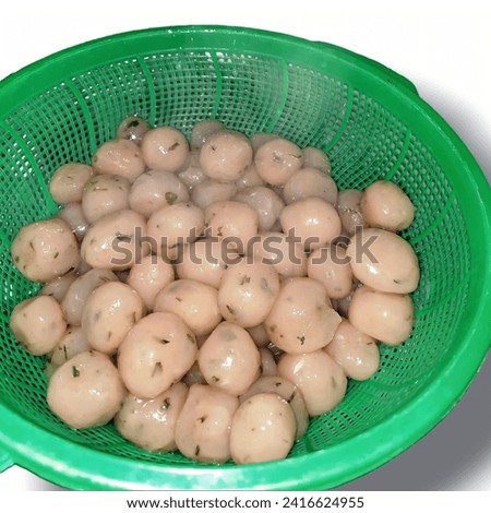 Cilok is a traditional food in the form of small balls from the flour mixture.Cilok is the abbreviation of ‘accreted’. It is usually enjoy with many sauce type like peanut, chilli or even tomato sauce Royalty-Free Stock Photo #2416624955