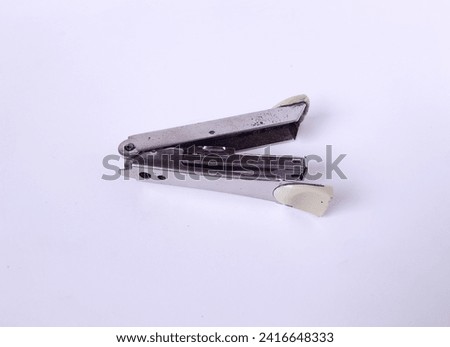 Close-up of a white stapler, an office tool for study and work. Isolated on white background