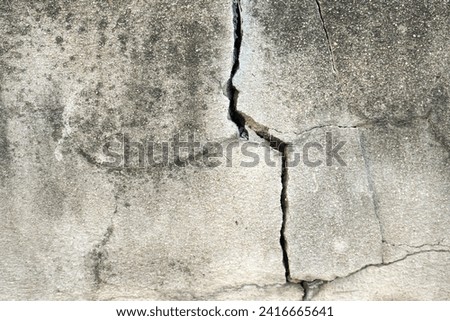Old cracked plaster on the wall. Retro texture. Vintage texture. Distress Texture. Scratched wall pattern