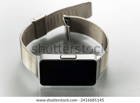 Smart watch with metal bracelet on white background