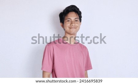 Handsome Asian man with a thin smile poses coolly on a white background Royalty-Free Stock Photo #2416695839