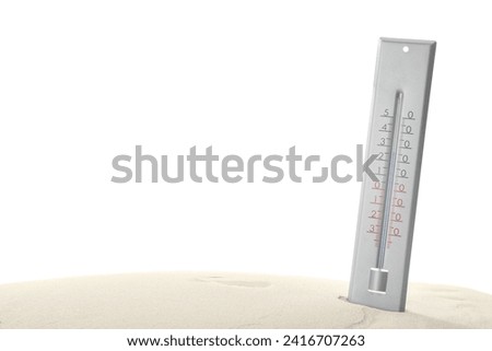 Weather thermometer in sand against white background Royalty-Free Stock Photo #2416707263