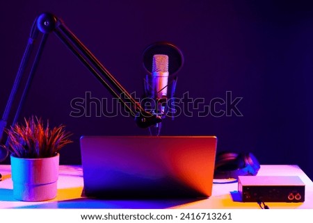Professional microphone and laptop in recording studio