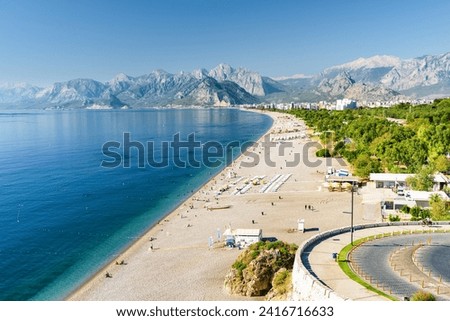 Awesome view of Konyaalti Beach and Park in Antalya, Turkey. Drone flying over the beach. Konyaalti Beach is a popular tourist attraction in Turkey. Royalty-Free Stock Photo #2416716633