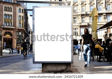 bus shelter with blank white ad billboard at busstop. urban street setting. glass structure. blank area for poster sign. lightbox. banner and copy space. selective focus. mockup base. soft background