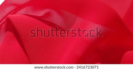 Wavy red chiffon fabric in folds (macro, texture).
 Royalty-Free Stock Photo #2416723071