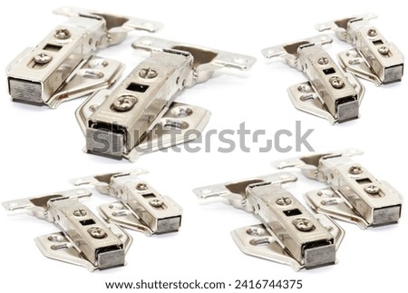 A picture of Stainless Steel Hydraulic Hinges with selective focus Royalty-Free Stock Photo #2416744375