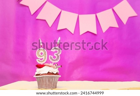 Background date of birth with number  93. Pink background with a cake and burning candles, save space, happy birthday anniversary for a girl. Holiday pudding muffin. Royalty-Free Stock Photo #2416744999