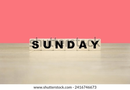 Sunday word written on wooden blocks. Sunday text for your desing, concept.