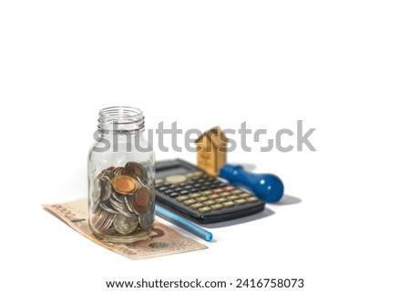Pictures of coins and money and calculator put on white background with financial statements concept.