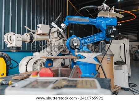 Industrial robot arm storage, product distribution Robot concept, Concept of artificial intelligence for the industrial revolution, and automation manufacturing process. 
