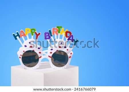 Sunglasses, cheerful holiday. Festive and colorful mood. Copy space for text.