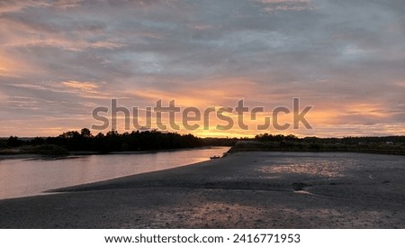The sun sets over the river estuary and mangrove forests