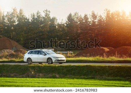 A New and Modern Station Wagon Car on the Highway. A Spacious and Elegant Vehicle for Family and Sport. How to Combine Practicality and Style in a Car. A Combi Car with a Powerful Engine. Royalty-Free Stock Photo #2416783983