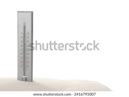 Weather thermometer in sand against white background Royalty-Free Stock Photo #2416795007