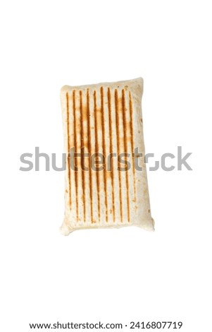 a high-resolution from the side image of a meticulously prepared grilled wrap that has been toasted to perfection, boasting an appetizing golden-brown hue.