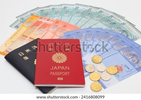 Japanese passport and Malaysian ringgit