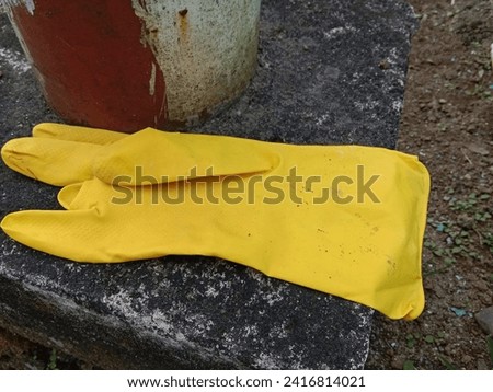 a glove made of yellow rubber