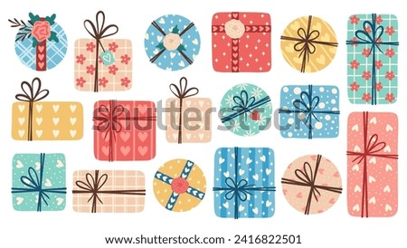 Set of gift boxes. Present package wrapped in festive paper wrapping with tied bow, ribbon, twine string. Christmas, Xmas, valentine's day, birthday and New Year present in wrapping paper.	