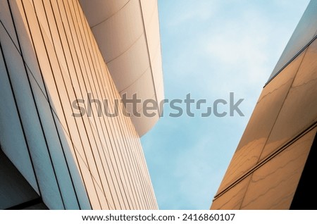 wall of a modern building on a background of blue sky abstract architectural background
