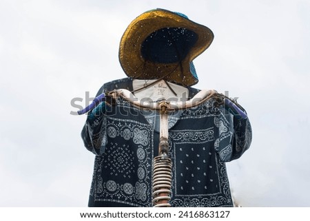 Cowboy Scarecrow that can move up and down when the wind blows