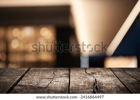 empty wooden table on bokeh background of cafe interior. Empty space to display your products.
