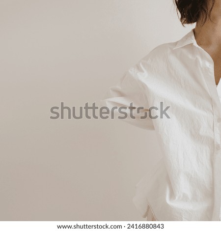 Young beautiful woman in white shirt. Minimal aesthetic beauty, fashion concept for magazine, blog, social media. Copy space Royalty-Free Stock Photo #2416880843