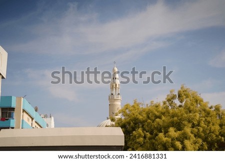 mmerse yourself in the awe-inspiring details of this high-resolution stock photo capturing a close-up view of a grand mosque. The image showcases the intricate architectural elements, from ornate mina