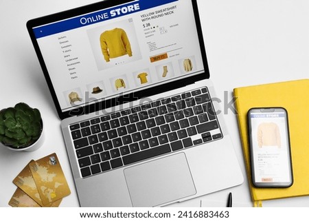 Online shopping. Composition with laptop on white background, above view