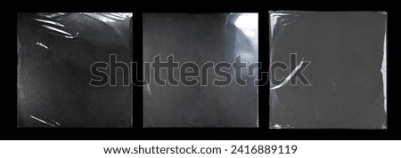 Vinyl cover with shrinks and transparent overlay effect. Realistic illustration set of square plastic package mockup - texture of cellophane or polythene seal wrapper with wrinkle and creases. Royalty-Free Stock Photo #2416889119