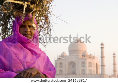 Indigenous Indian woman and Taj Mahal as a background.