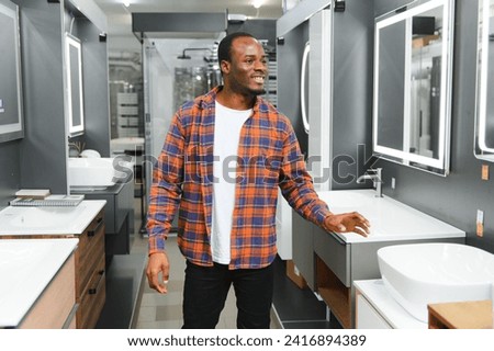 african american at the building market looking for sink into their bathroom.