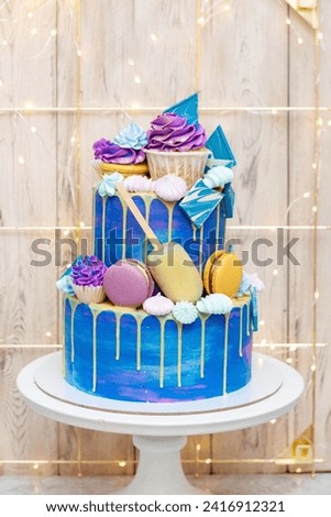 Layered blue cake on cake stand on a festive background. A picture for a menu or a catalog of confectionery products.