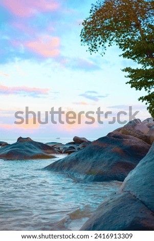 picturesque bright sunrise on famous beach Beau Vallon in Seychelles, nature background