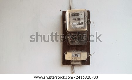 Yogyakarta 15 Jan 2024 - Local officer is installing an electricity meter switch for home use