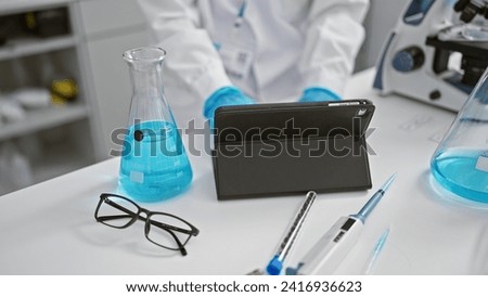 In the heart of science, hands of a dedicated, professional woman scientist, wielding a touchpad in a bustling, high-tech lab, advancing medicine realm with intense analysis