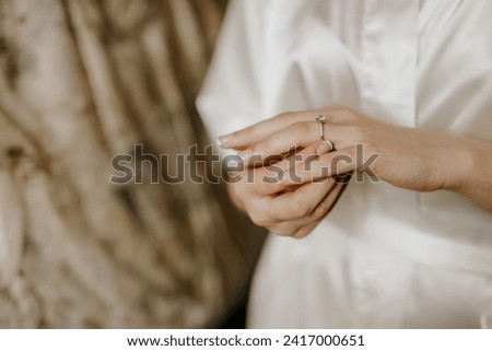 woman's hand with a diamond ring on her finger, close-up stock photo