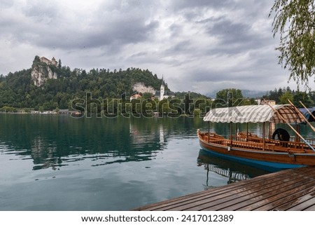 Lake Bled Slovenia. Beautiful mountain lake with small Pilgrimage Church. Most famous Slovenian lake and island Bled with Pilgrimage Church of the Assumption of Maria and Bled Castle in background.