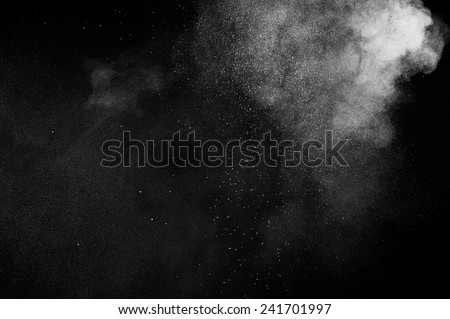 abstract white powder explosion  on black background Royalty-Free Stock Photo #241701997