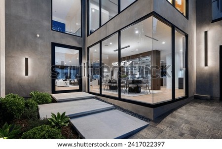 A spacious glass building with contemporary design, featuring side stairs for convenient access, New Construction Home in Tarzana, California Royalty-Free Stock Photo #2417022397